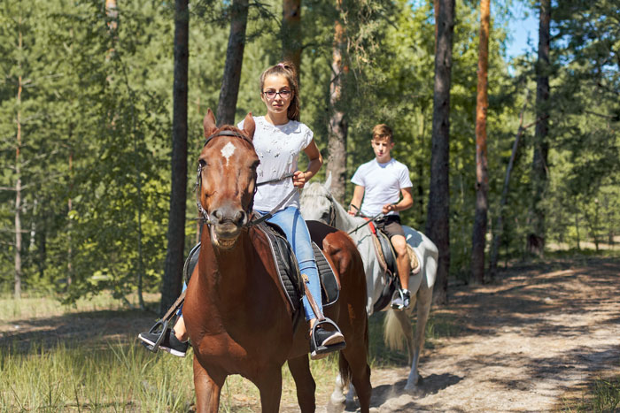 teenage horseback riders
        